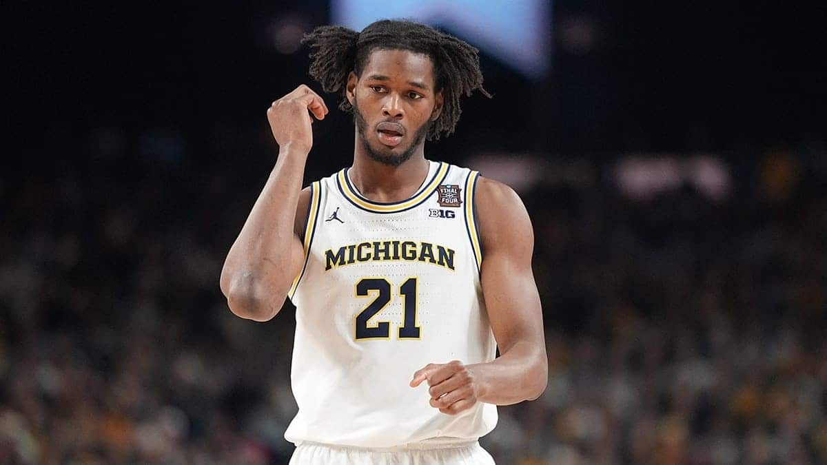 Morez Johnson Jr. walks on the basketball court