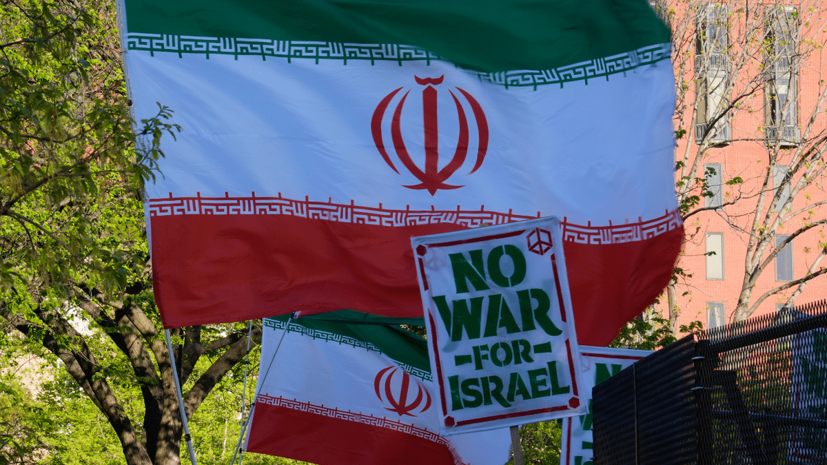 Iranian flags fly at pro-Iran protest at the White House.