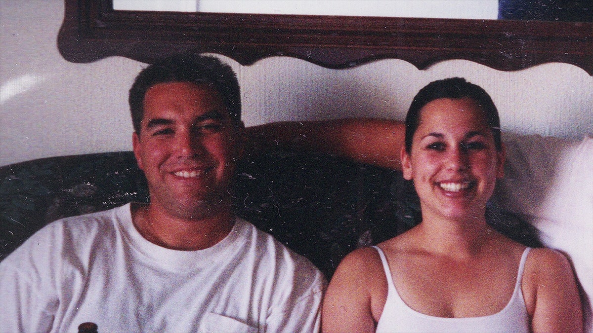 Scott Peterson and Laci Peterson posing together in a still photo