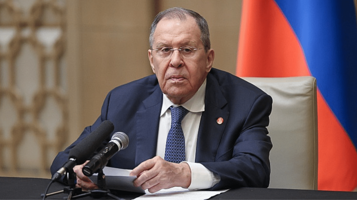 Russian foreign minister Sergey Lavrov sits behind a microphone