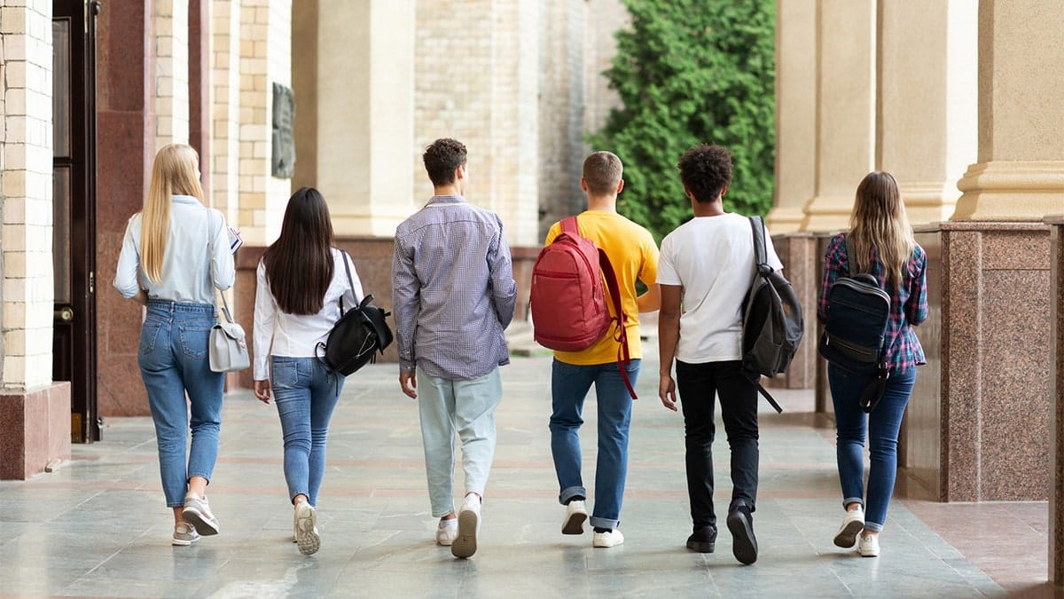 Students walking back view