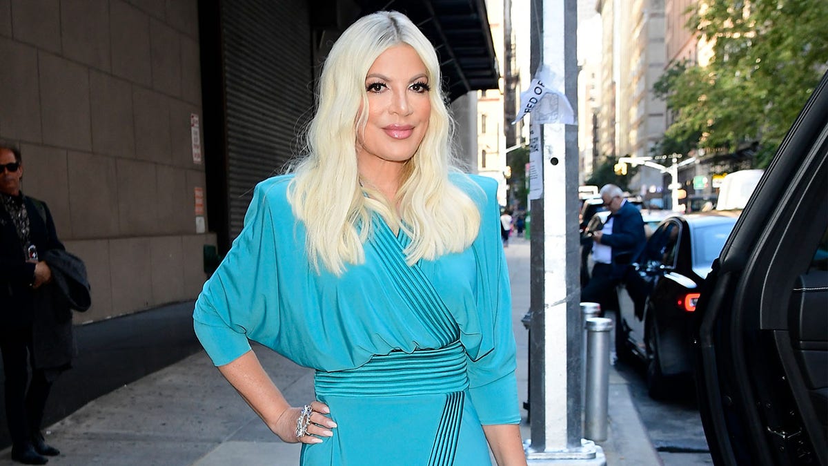 Tori Spelling posing for photos outside Fox Studio in New York City