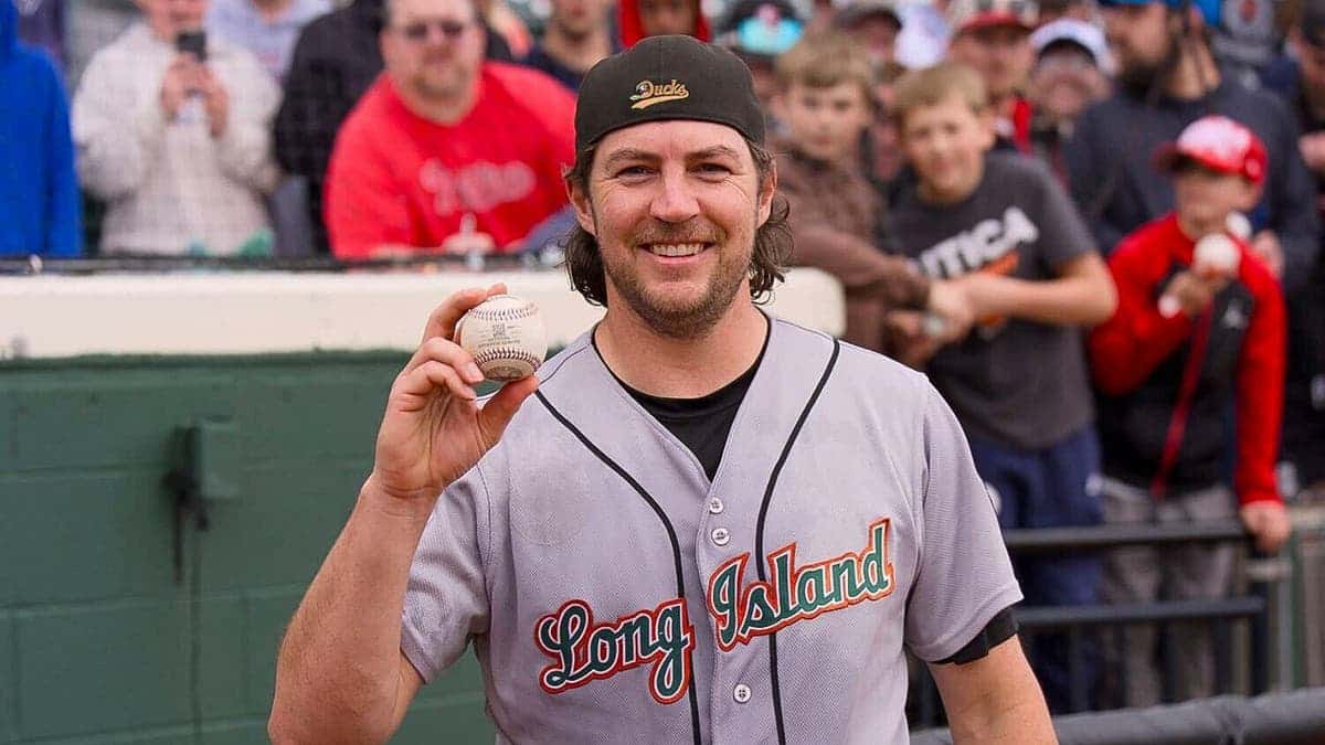 Trevor Bauer smiles with baseball