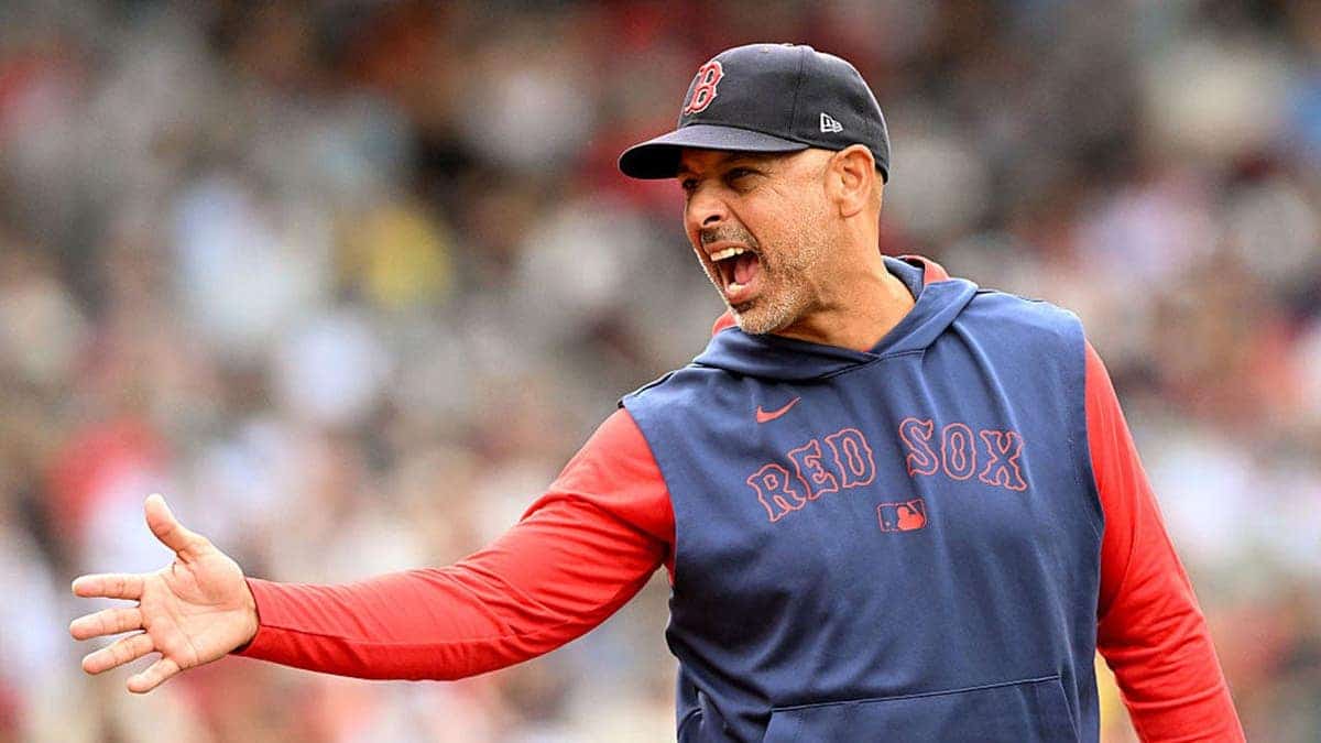 Alex Cora arguing with umpire Jordan Baker at Fenway Park in Boston