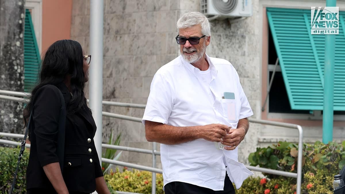 Brian Hooker and Terrel A. Butler standing inside the Central Police Station in Freeport, The Bahamas