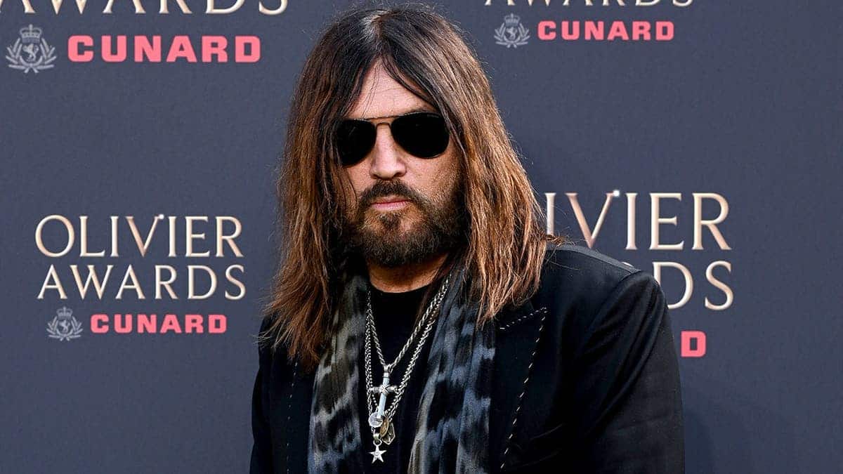 Billy Ray Cyrus poses on red carpet at Olivier Awards in London.