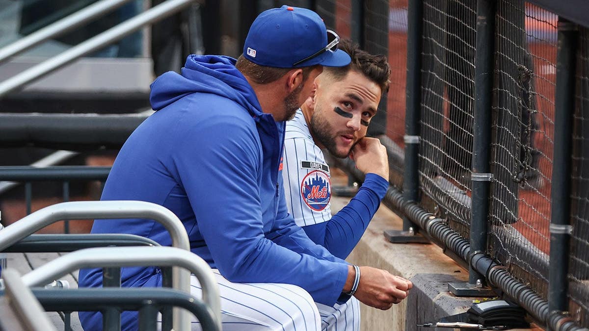 New York Mets third baseman Bo Bichette talks with catching coach J.P. Arencibia at Citi Field