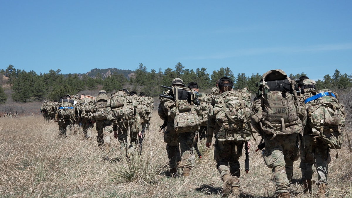 Cadets hike through woods