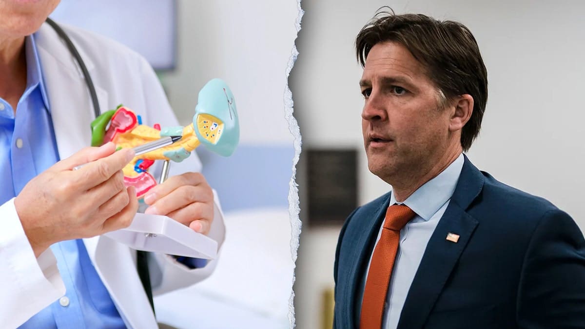 Former Sen. Ben Sasse standing next to a pancreatic cancer model