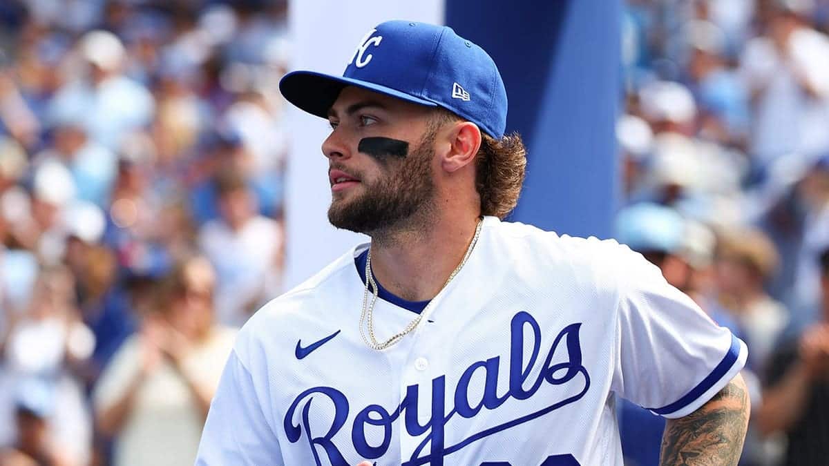 Carter Jensen wearing Kansas City Royals uniform takes the field at Kauffman Stadium.