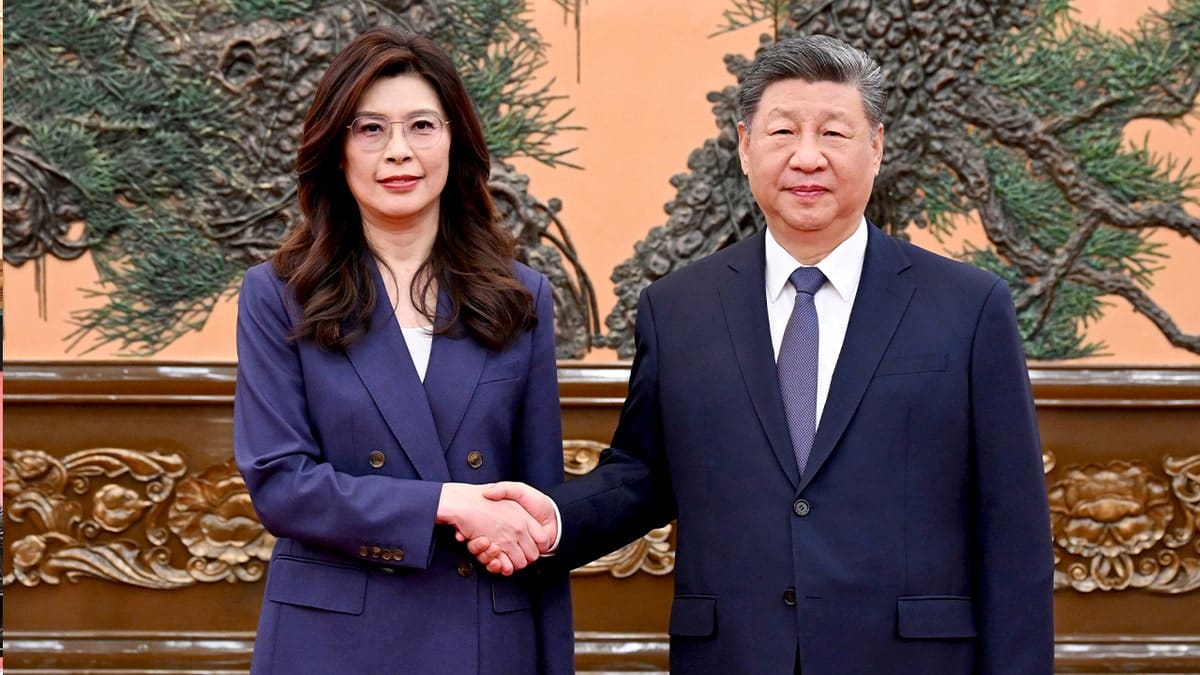 Cheng Li-wun and Xi Jinping shake hands, looking at the camera.
