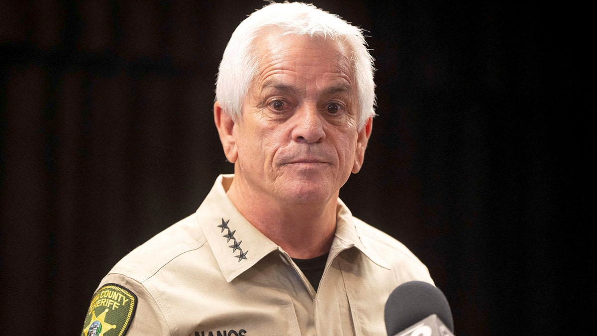 Pima County Sheriff Chris Nanos speaking at a podium during a press conference