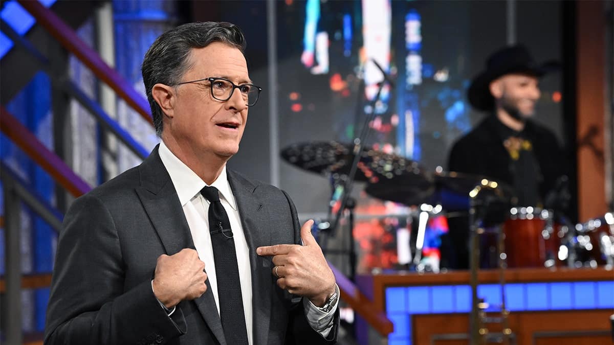 Stephen Colbert standing on the set of The Late Show with Stephen Colbert