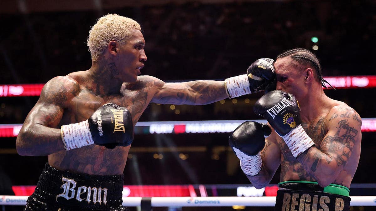 Conor Benn punches Regis Prograis during a boxing match at Tottenham Hotspur Stadium