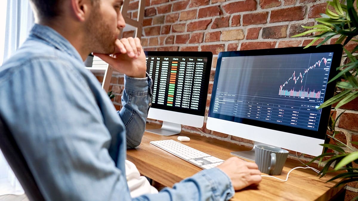 A man sits at a computer.