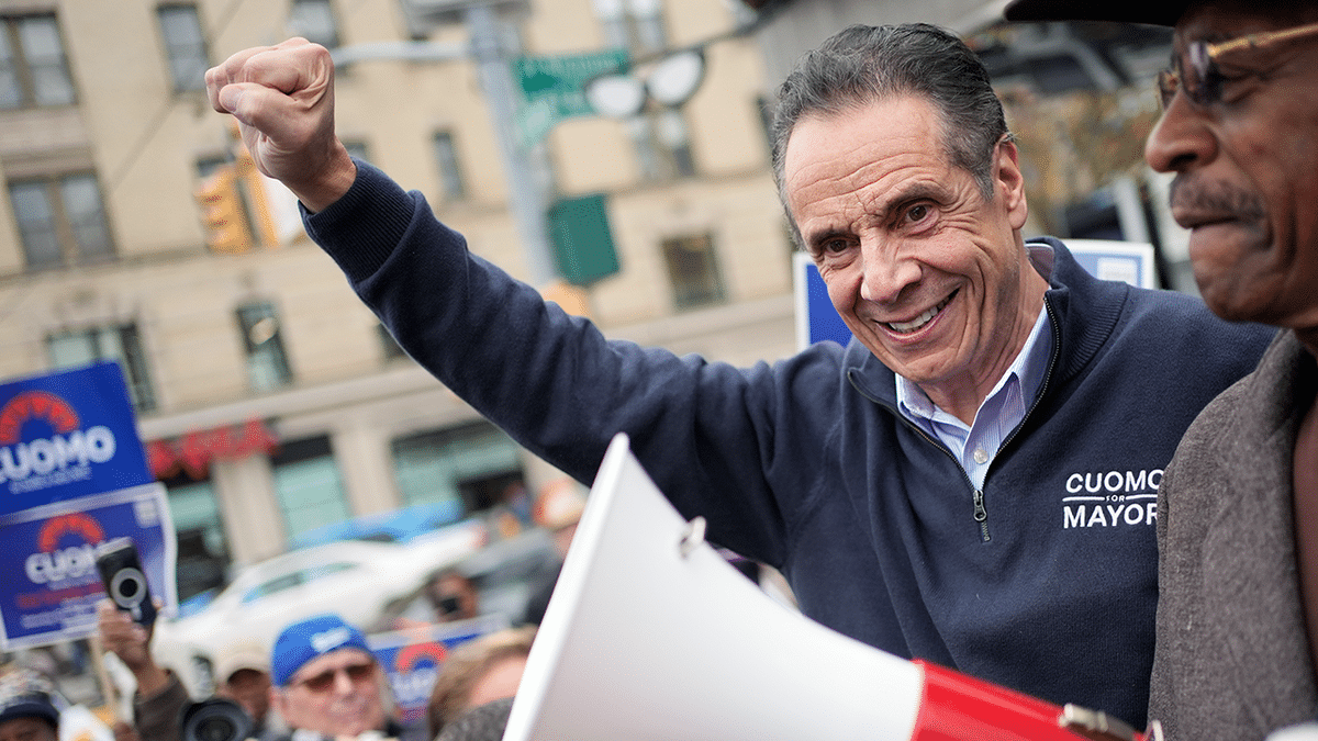 Andrew Cuomo cheering with supporters during campaign event in New York City