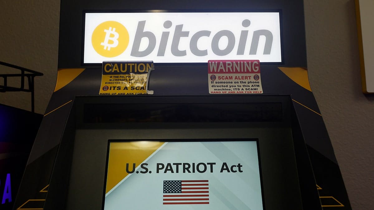 A bitcoin machine displaying U.S. PATRIOT Act on the screen.