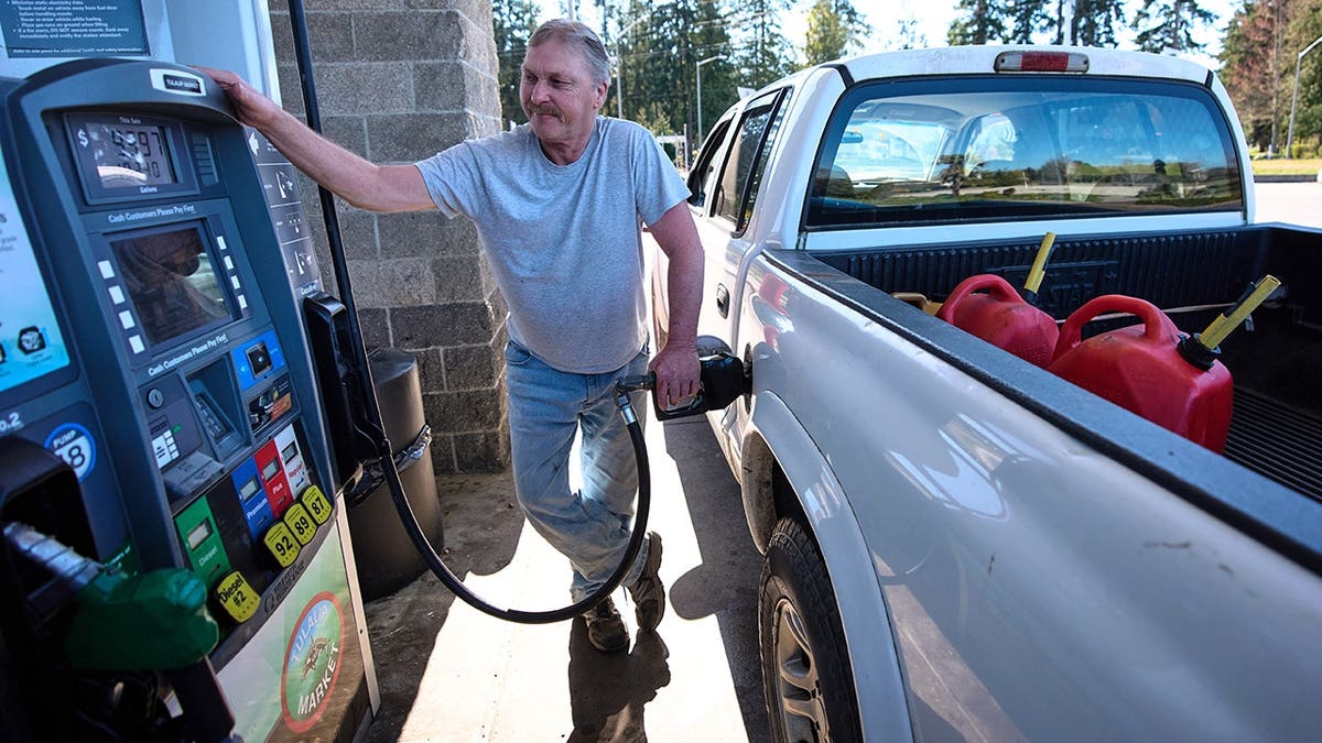 Darryl Smith pumps gas into his truck at Tulalip Market gas station