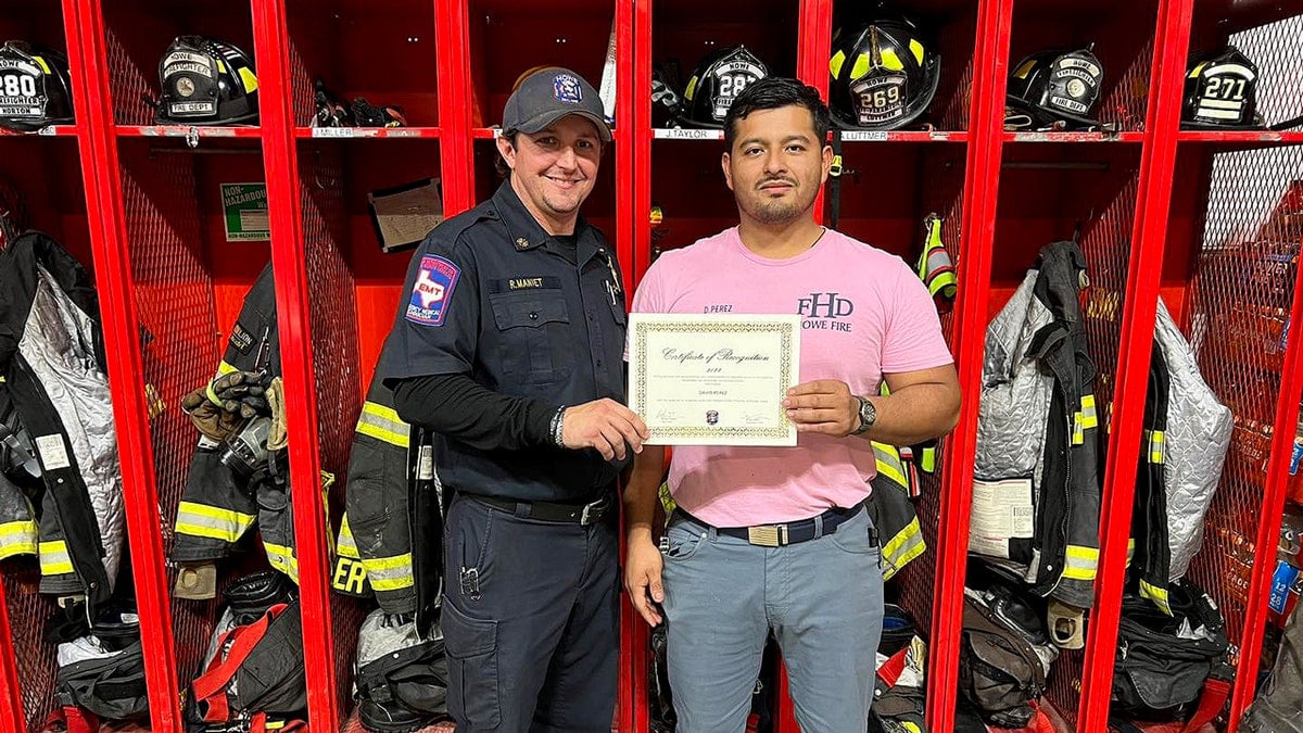 fire department honors Perez-Glass with certificate.