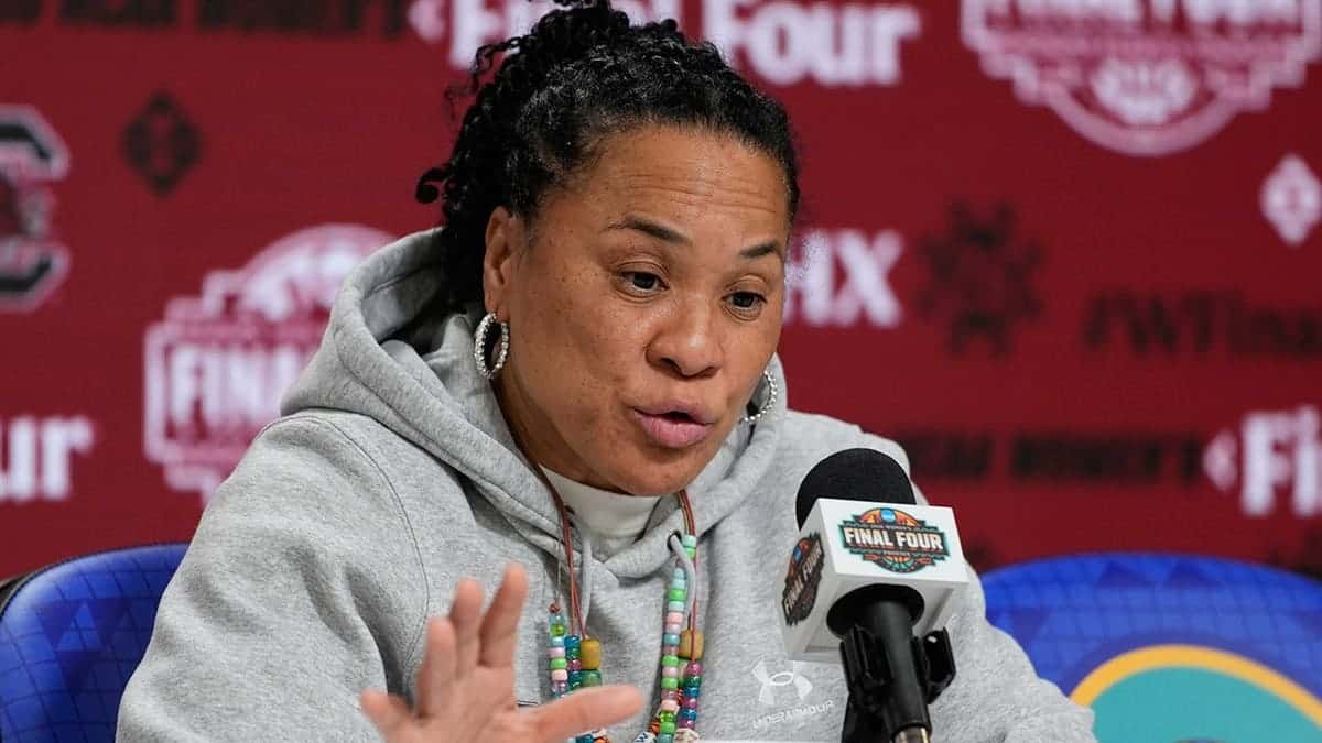 South Carolina head coach Dawn Staley speaking at a news conference