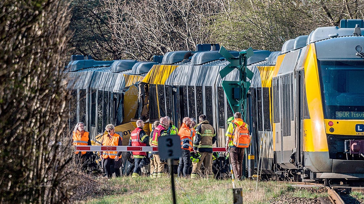 Rescuers working at site of two-train collision north of Copenhagen