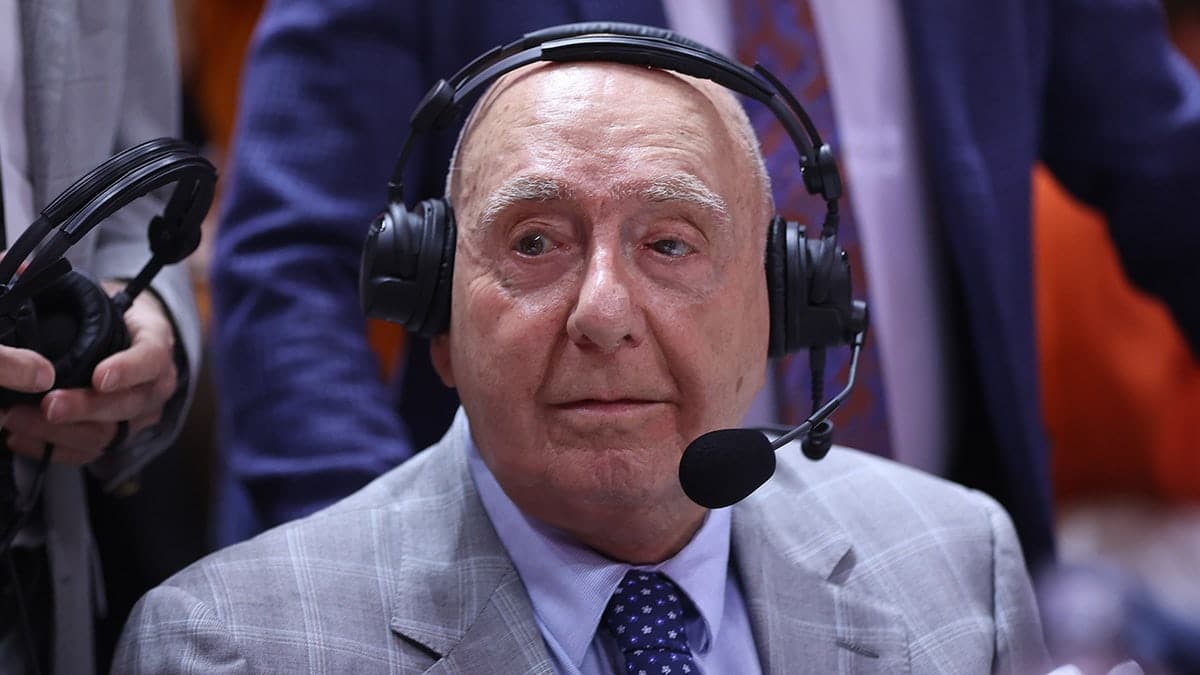 ESPN analyst Dick Vitale standing inside Thompson-Boling Arena before basketball game