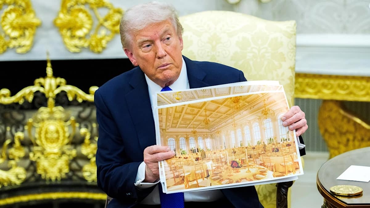 president donald trump holds renderings of the $400 million white house ballroom