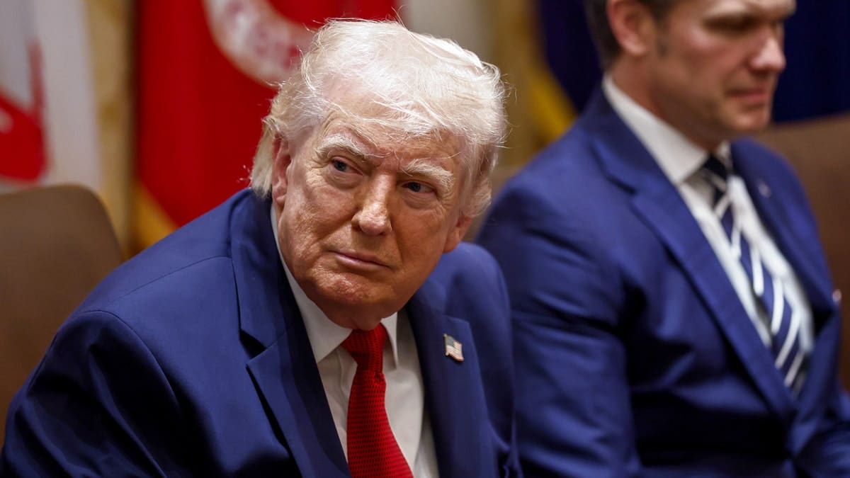 President Donald Trump and Pete Hegseth seated during a cabinet meeting at the White House