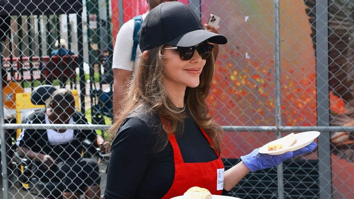 Donna D'Errico serving food while volunteering with the LA Mission on Skid Row in April 2026.
