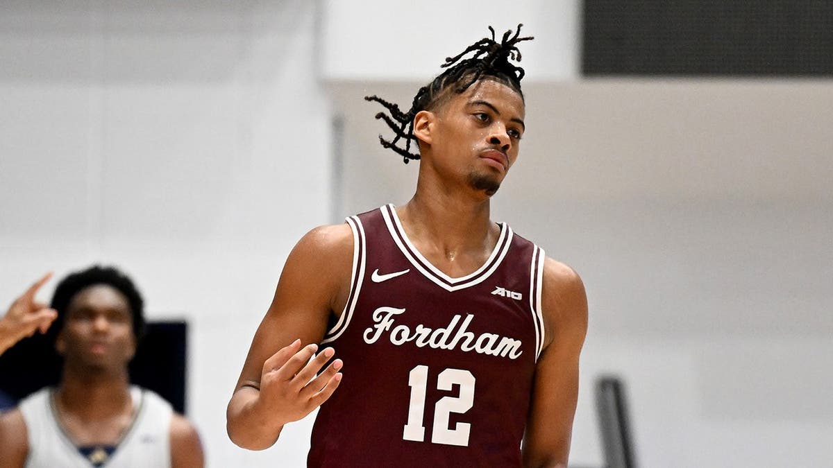 Elijah Gray of the Fordham Rams celebrating during a basketball game.