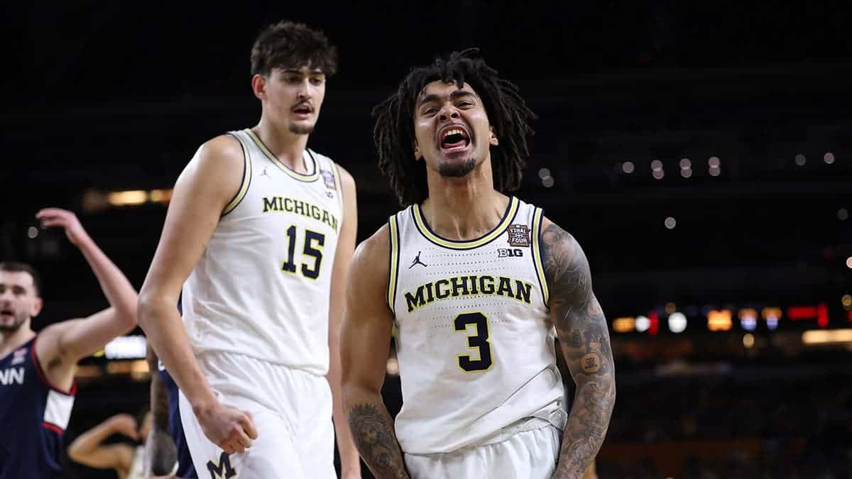 Elliot Cadeau celebrating during a basketball game at Lucas Oil Stadium in Indianapolis