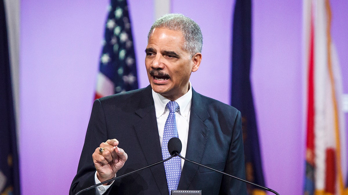 Attorney General Eric Holder delivering remarks at a podium