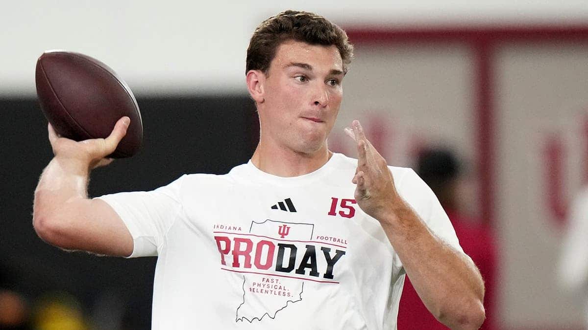Indiana quarterback Fernando Mendoza looks to throw a pass during pro day.