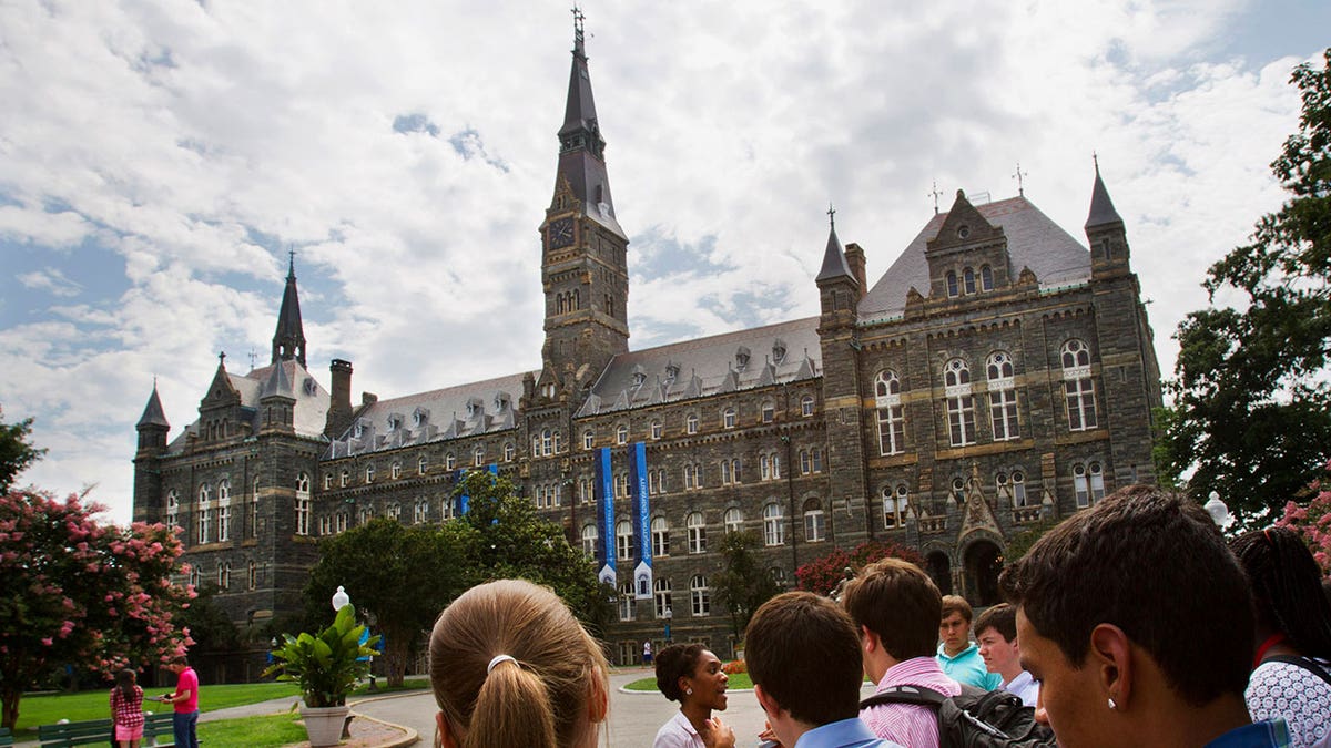 Prospective students touring Georgetown University campus outdoors