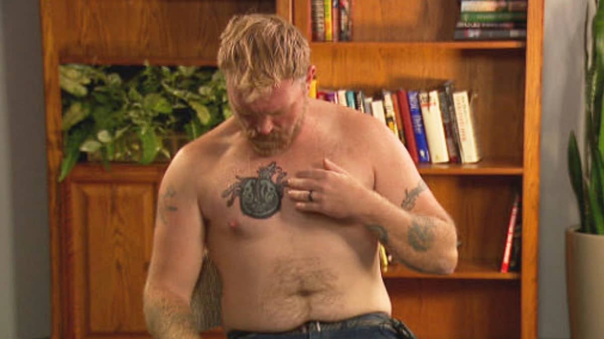 In this photo provided by WGME, Graham Platner, a Democratic candidate for U.S. Senate in Maine, points to a cover-up tattoo that had previously been an image recognized as a Nazi symbol, during an interview on Wednesday, Oct. 22, 2025, in Portland, Maine.