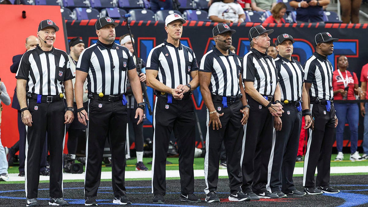 NFL referees standing on the field at NRG Stadium in Houston, Texas