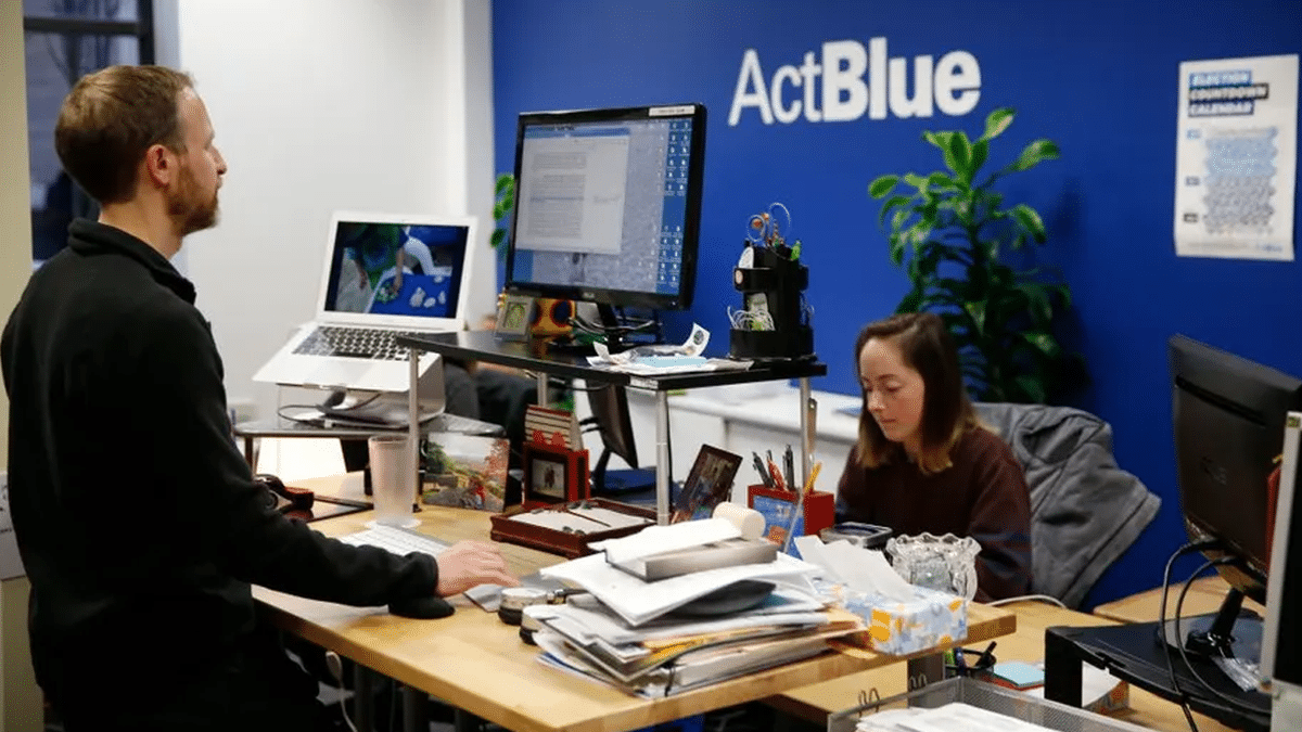 a person at an ActBlue office sits at a desk