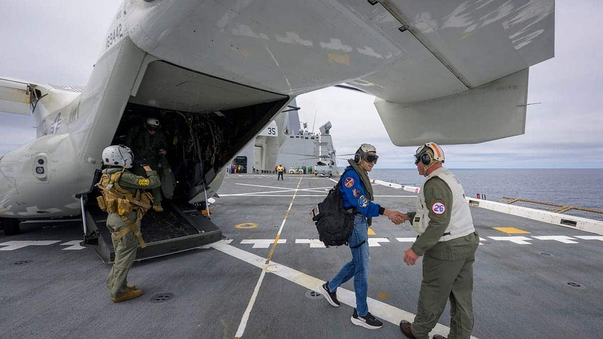 NASA Administrator Jared Isaacman greeted by Capt. Erik Kenny on USS John P. Murtha in Pacific Ocean