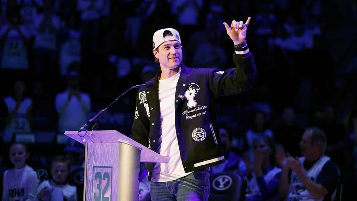 Jimmer Fredette waving during number retirement ceremony at Marriott Center in Provo Utah