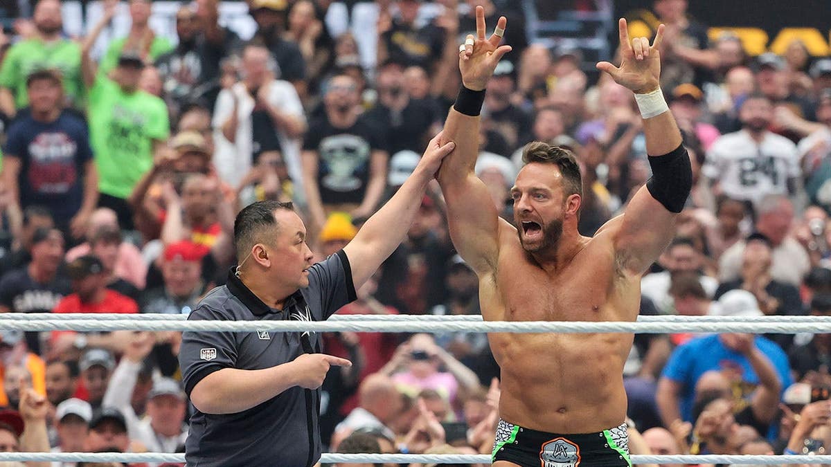 LA Knight celebrating in the ring at WrestleMania 42 in Las Vegas