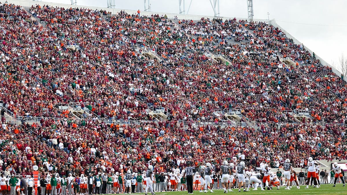 A crowd watching a football game at Lane Stadium in Blacksburg, Virginia.
