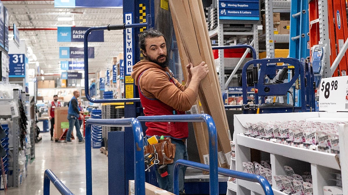 A worker stocking merchandise inside a Lowe's home improvement store in Chicago