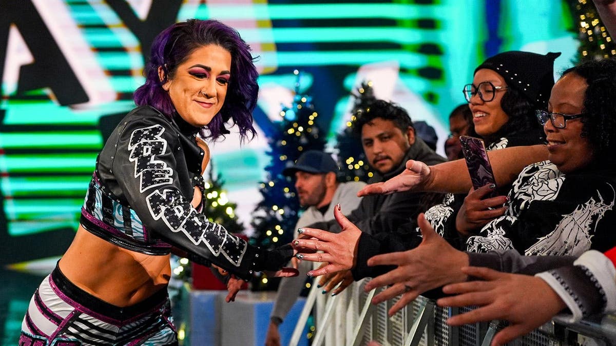 Lyra Valkyria and Bayley entering the wrestling ring at Van Andel Arena