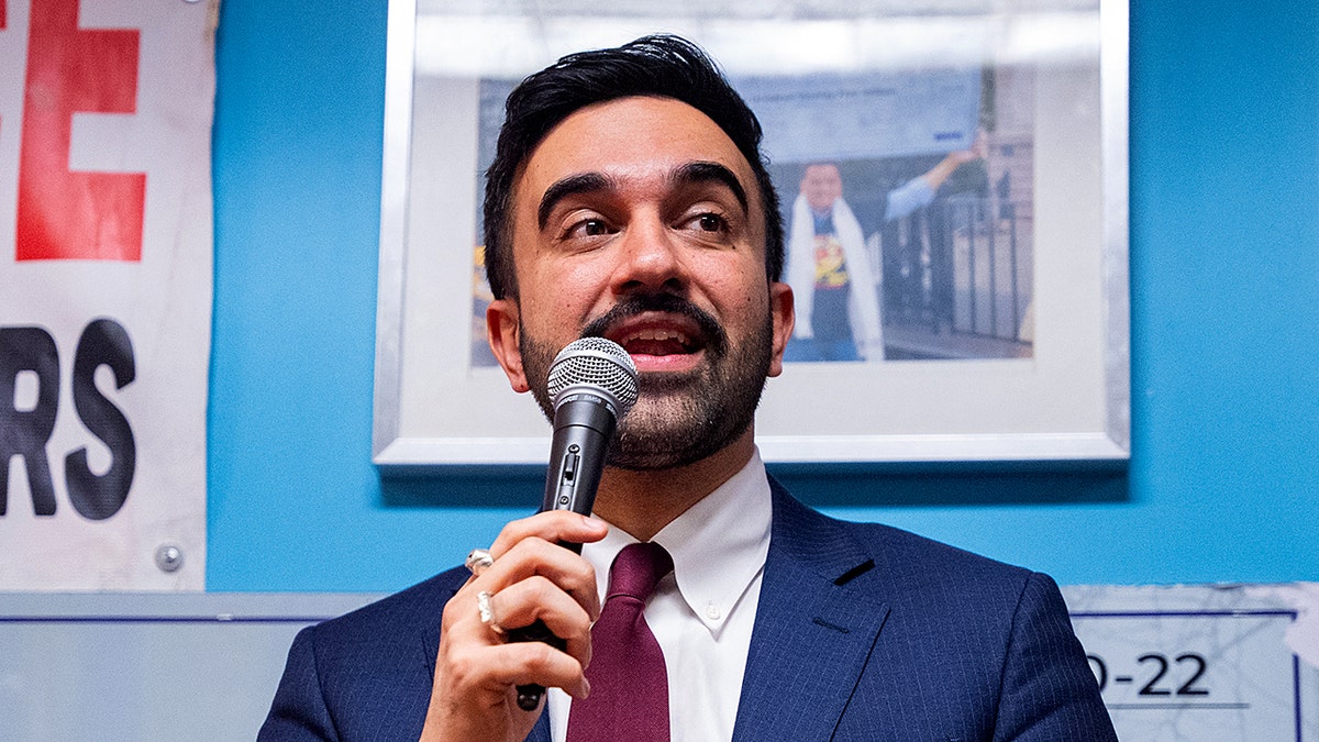 New York City Mayor Zohran Mamdani speaking at a podium during a Ramadan Iftar event
