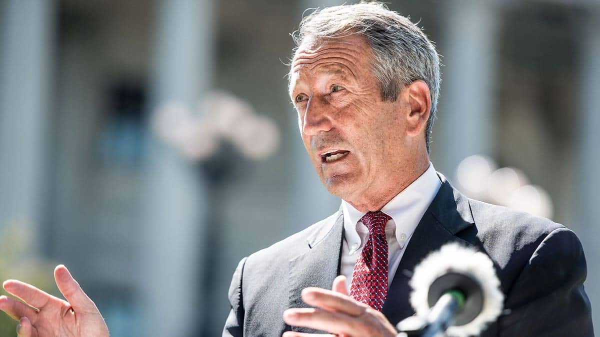 Former South Carolina Gov. Mark Sanford standing and smiling