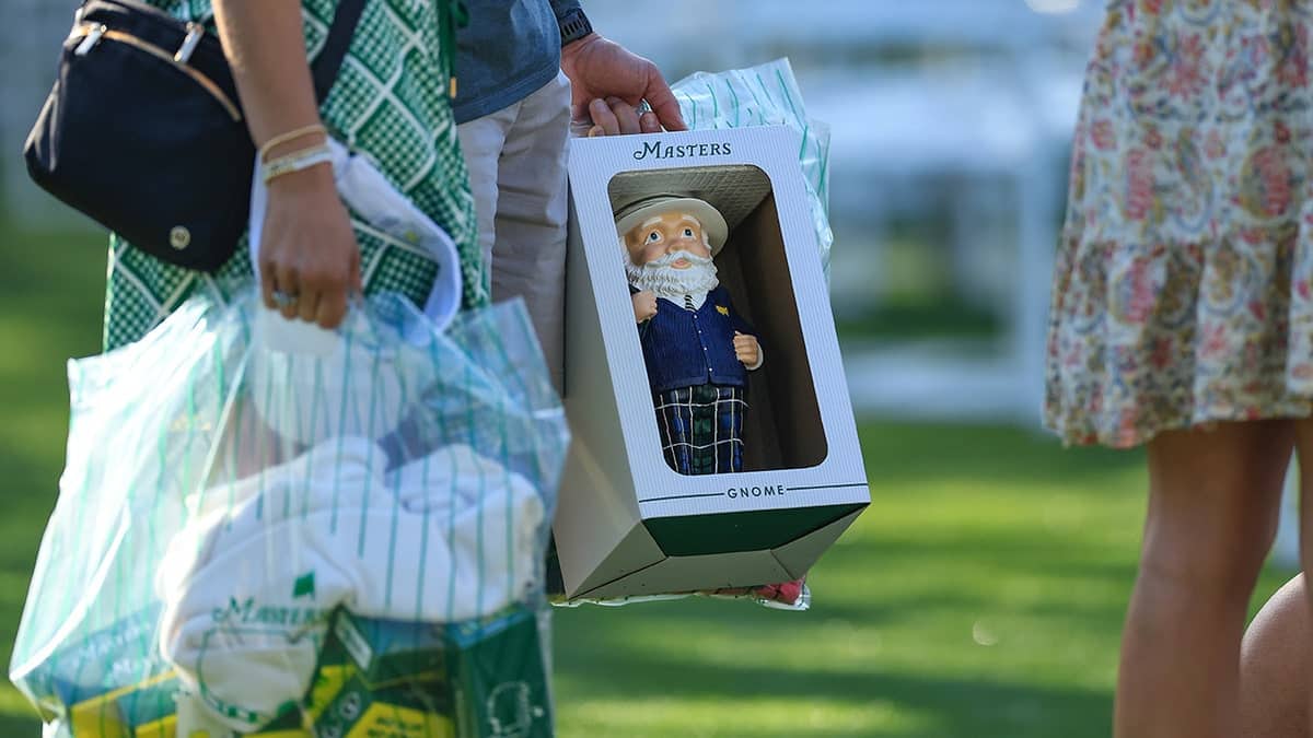A patron shopping with a gnome figurine at the Masters gift shop in Augusta National Golf Club