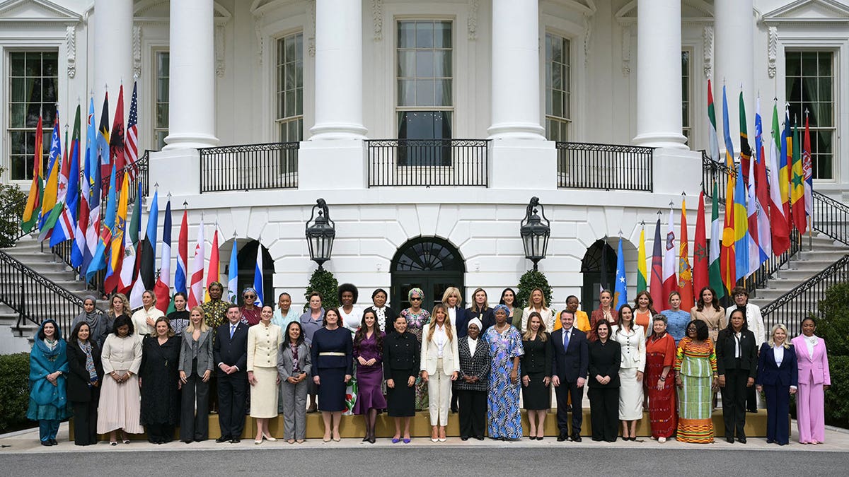 First lady Melania Trump poses with spouses of world leaders during the Fostering the Future Together Global Coalition inaugural meeting
