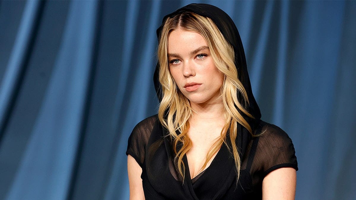 Milly Alcock poses on red carpet at Academy Museum Gala event.