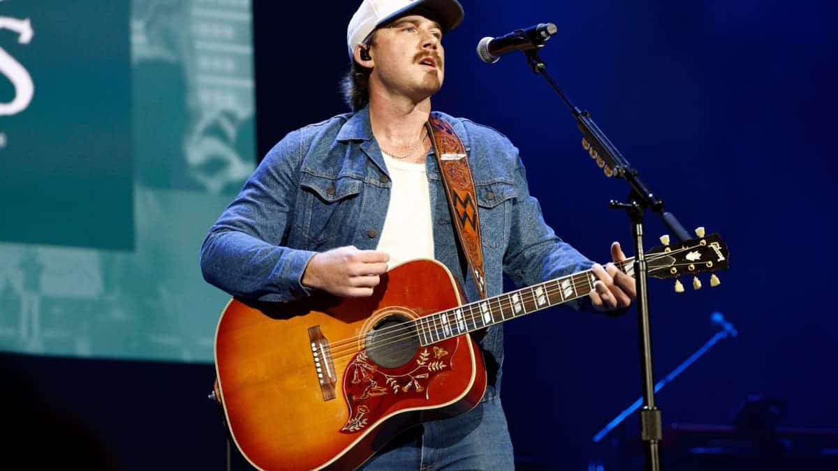 Morgan Wallen performing onstage at Ryman Auditorium in Nashville, Tennessee