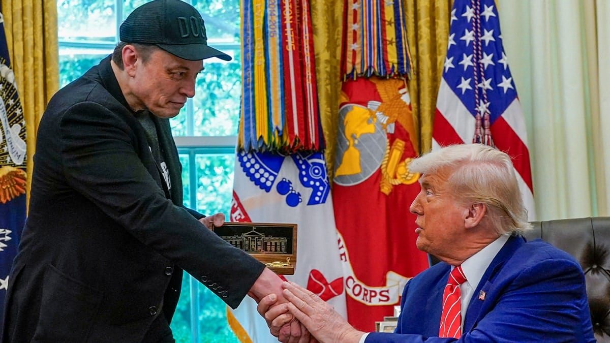 Elon Musk receiving a golden key from President Donald Trump in the Oval Office